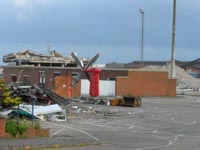 Just a propeller left standing, and the customs building